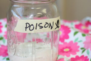Image of a killing jar with a label that reads poison