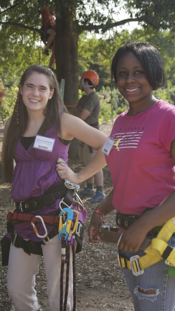 two young women in climbing gear